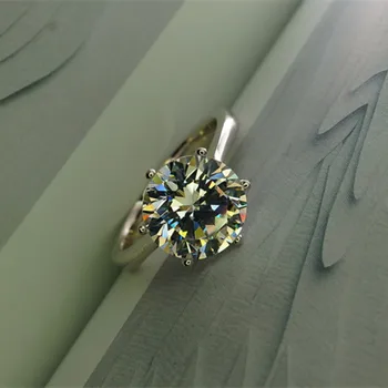 AINOUSHI Luksus Klassisk Solitaire 6 Kløer 4 Carat NSCD Ring for Kvinder 925 Sterling Sølv Engagement Bijoux Femme Vielsesring