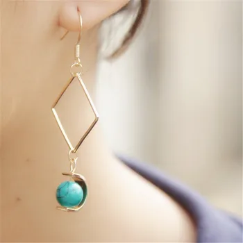 De Forenede smykker engros Kreative minimalistisk design Gennemsigtig glas perle asymmetrisk lange øreringe Eardrop kvindelige